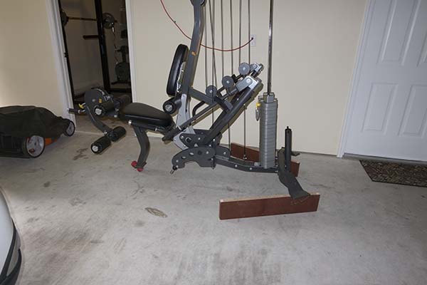 Photograph of Hoist V5 home gym sitting on blocks that were used to remove a furnture dolly underneath it.